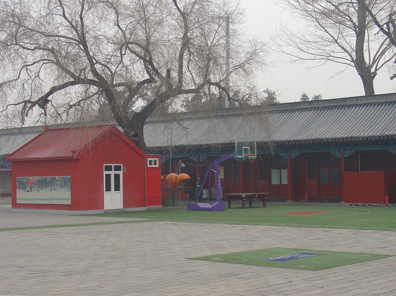 A basket ball hoop and a pool table in the Forbidden City