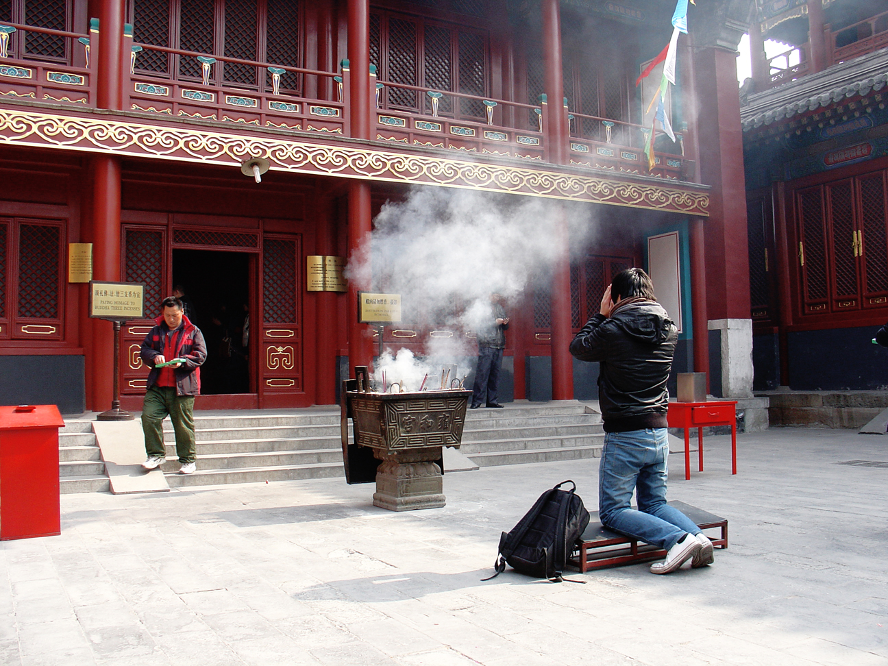 A man praying while using incenses