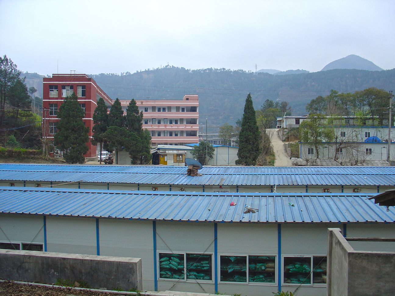 The old Qingchuan Vocational High School - Only one teaching building was not destroyed through the earthquake. The blue buildings used to be the emergency shelters.