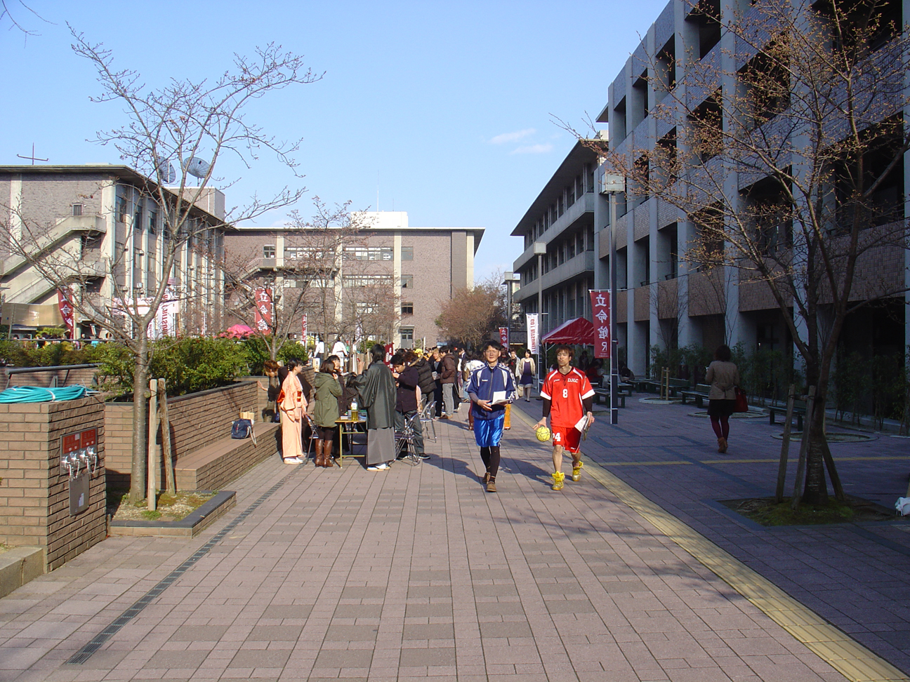 Two students promoting their club on campus.