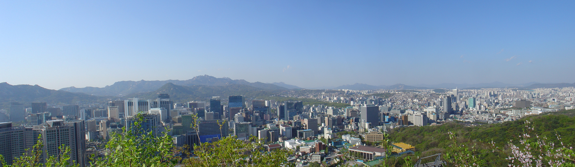 The skyline of Seoul with the hills in the background.