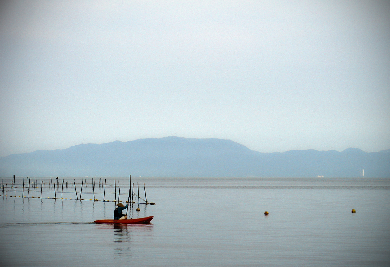 A man rowing his boat II