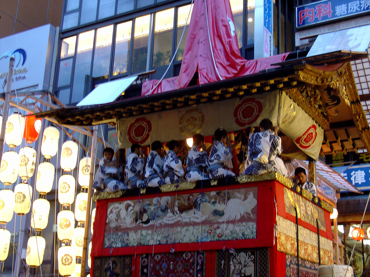 Artist sitting in the float and playing music.