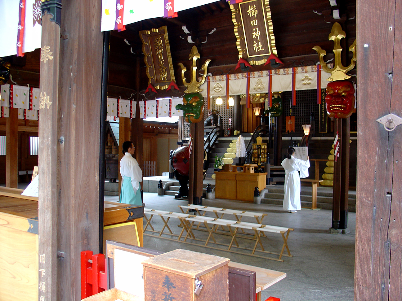 A young woman practising the rites at Kushida Shrine.