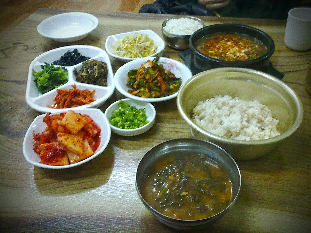 Jjigae (찌개) with side dishes and rice.