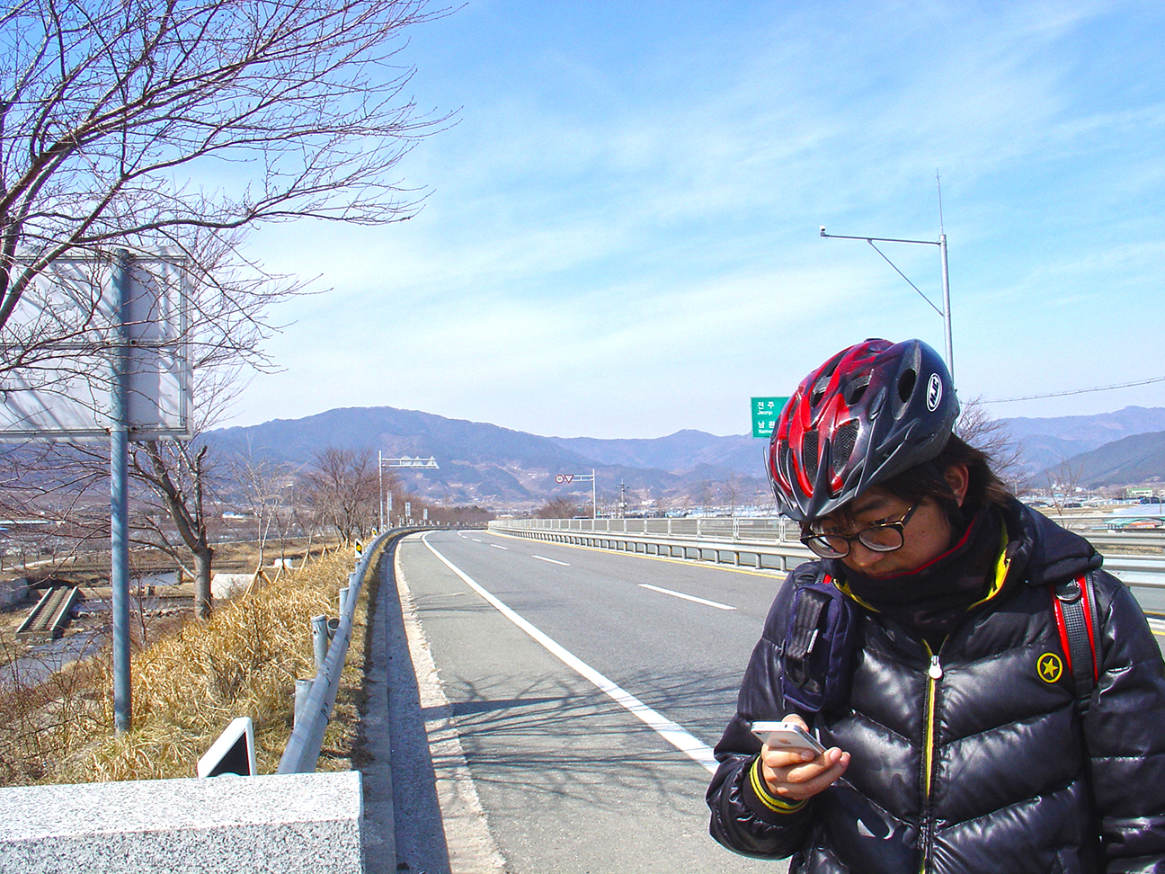 My companion checking the maps on the road.